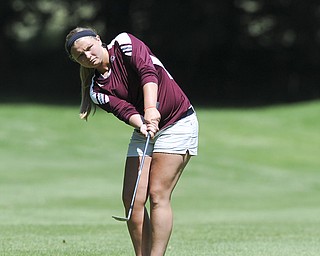 Anna Pastoray of Boardman chips her ball from the rough and toward the green on the 11th hole Friday morning at Tamer Win in Cortland. 