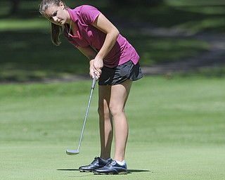 Mary Hunt of Poland follows through on her putt on the 11th hole Friday morning at Tamer Win in Cortland. 