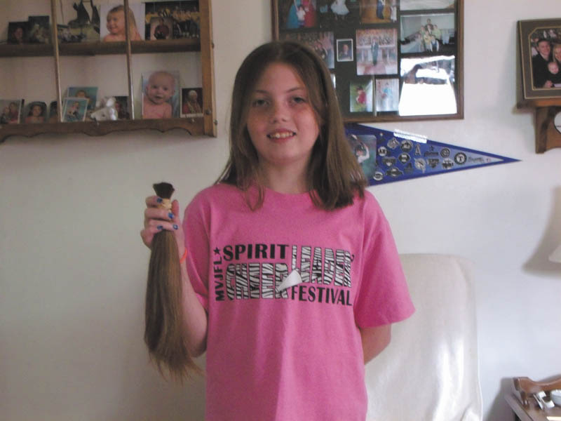 Haylie Rotz, 12, holding her recently shorn locks, donated her hair to Locks of Love on June 15 for the sixth time. She began donating when she was 2. Haylie is the daughter of John and Lisa Rotz of Lowellville, and the granddaughter of William and Julie Brozman and Stephen and Lucille Gocala. Locks of Love helps disadvantaged children 18 and under with medical conditions by providing hairpieces that help restore their self-esteem and confidence. Hair donation guidelines are available at www.locksoflove.org.