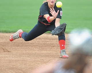 Canfield second basemen Maura Kennedy dives to catch a ball hit by Boardman’s Lauren Pavlansky in the top of the first inning Tuesday night in a District 2 Junior League title game.