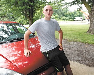 Justin Sikora is a senior at South Range High School who is organizing a car/truck show to benefit the Easter Seals as part of his senior project.  ROBERT K. YOSAY  | THE VINDICATOR
