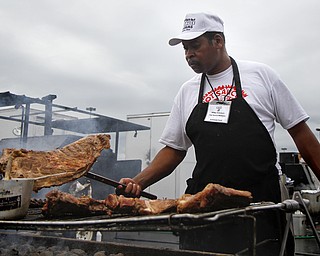 MADELYN P. HASTINGS | THE VINDICATOR


Willie Coleman flips racks of ribs on the grill for the 'Hot Sauce Williams' booth at the Eastwood Rib Fest in Niles on Saturday, July 20. The event runs through Sunday.