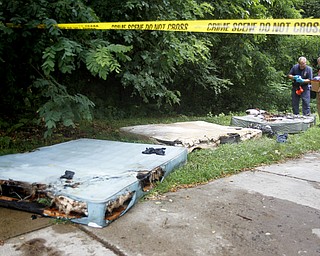 MADELYN P. HASTINGS | THE VINDICATOR

Burned mattresses were placed outside at 47 7th street in Campbell where a 5 victim shooting and fire occurred on Saturday, July 20.