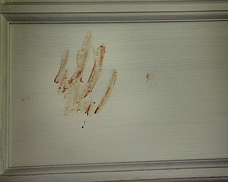 MADELYN P. HASTINGS | THE VINDICATOR

A bloody handprint was found at 37 7th Street in Campbell, directly next door to 47 7th Street where a 5 victim shooting and fire occurred on Saturday, July 20.