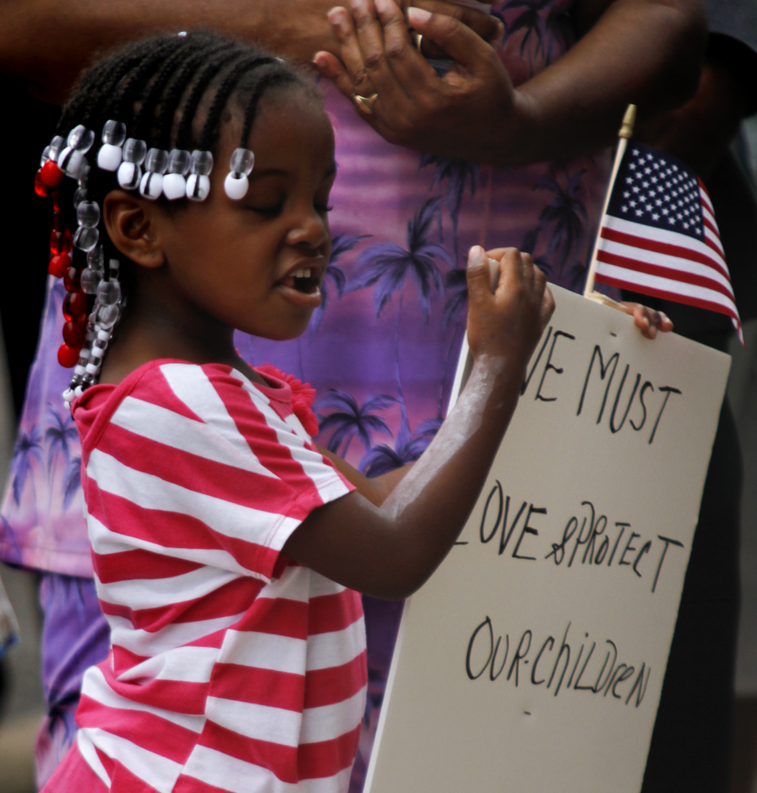 MADELYN P. HASTINGS | THE VINDICATOR

Ja'Layia Hunter, 4, wears white paint on her skin while participating in a "Justice for Trayvon" rally on the steps of the Mahoning County Courthouse on Saturday, July 20.