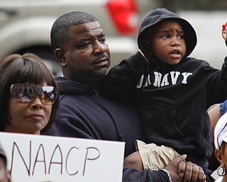 MADELYN P. HASTINGS | THE VINDICATOR

(L-R) Evelyn Jenkins, Tito Brown and Quentin Brown, 3,  participate in a "Justice for Trayvon" rally on the steps of the Mahoning County Courthouse on Saturday, July 20.