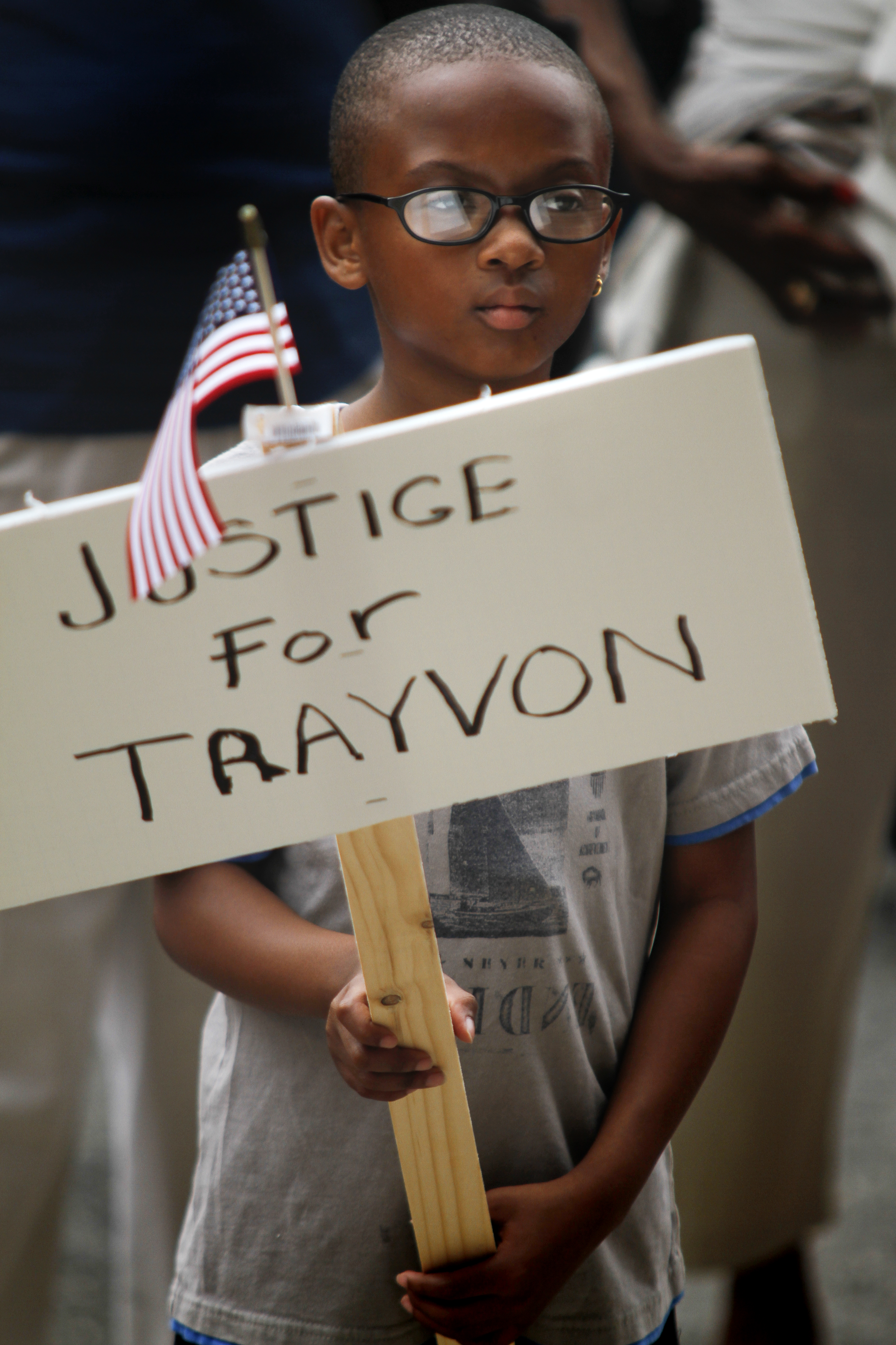 MADELYN P. HASTINGS | THE VINDICATOR

Isaiah Carter, 10, participates in a "Justice for Trayvon" rally on the steps of the Mahoning County Courthouse on Saturday, July 20.  