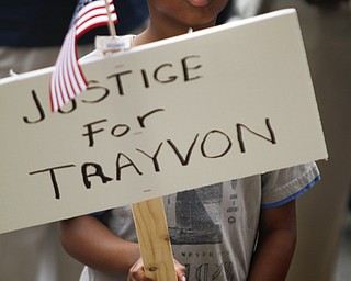 MADELYN P. HASTINGS | THE VINDICATOR

Isaiah Carter, 10, participates in a "Justice for Trayvon" rally on the steps of the Mahoning County Courthouse on Saturday, July 20.  