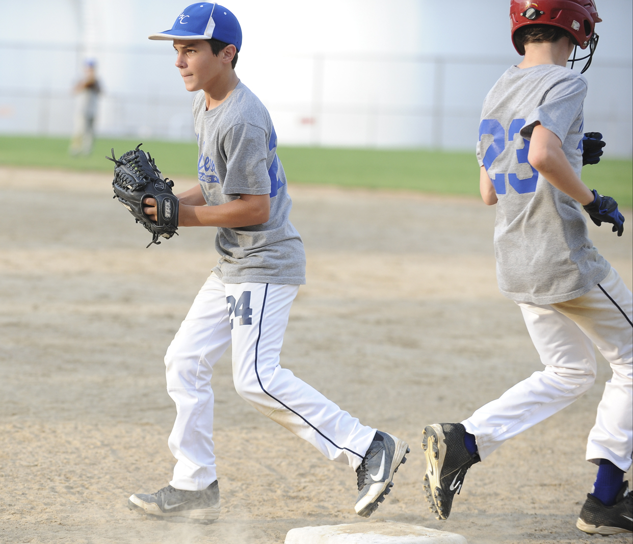 Mill Creek infielder #24 Dom Montalbano steps on first base to force out base runner #23 Patrick Donofrid during practice Sunday night.
