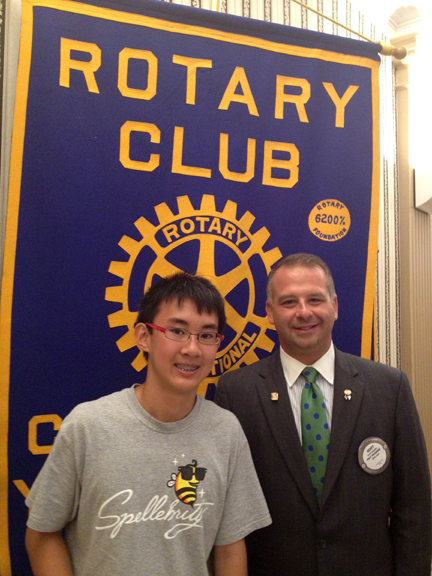 SPECIAL TO THE VINDICATOR
The Rotary Club of Youngstown honored Max Lee, left, winner of The Vindicator’s 2013 Regional Spelling Bee, at its July 17 meeting at the downtown YMCA. Max received a $50 gift card to iTunes from the club. Scott Schulick, right, is the club president.