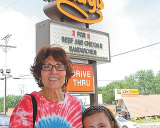 Joyce Masko and her granddaughter Jenna Billet were among the dozens who came to the Arby’s in Boardman to
take advantage of coupons for 64-cent regular roast-beef sandwiches. The fast food franchise began in Boardman on July 23, 1964.