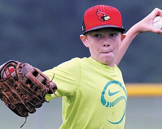 Dominic Pilolli warms up for the Canfield 10-11-year-old baseball team.