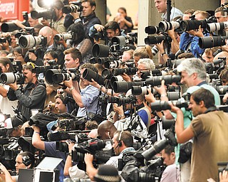 Hundreds of media members from around the world capture the moment Prince William and his wife, Kate, leave the Lindo Wing of St. Mary’s Hospital in London on Tuesday with their newborn son.