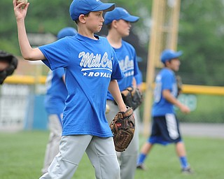 Mill Creek player #19 Stephen Babik throws the baseball during while playing catch during practice Monday morning.