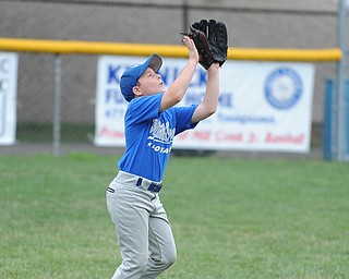 Mill Creek outfielder #8 Zachary Saunders gets under a fly ball during practice Monday morning.
