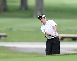 Jacob Stefko chips his ball out from the rough and onto the green on the 18th hole Wednesday afternoon at Mill Creek Golf Course. 