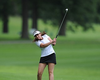 Julie Mortellaro of Poland chips his ball onto the green from the short rough on the 18th hole Wednesday afternoon at Mill Creek Golf Course. 