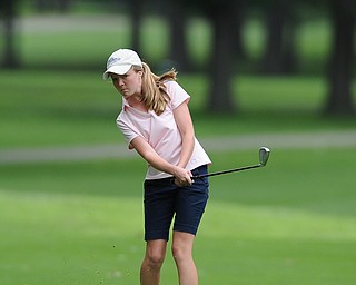 Nadya Stratton of Boardman chips her ball on to the green on the 9th hole Wednesday afternoon at Mill Creek Golf Course. 