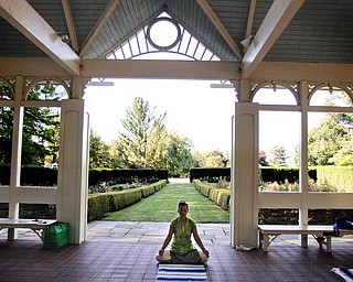 MADELYN P. HASTINGS | THE VINDICATOR

Karres Cvetkovich teaches a yoga class at the Fellows Riverside Gardens in Mill Creek Park on Thursday, July 25. Pilates and tai chi are also offered through the 'Scenic Fitness Workshop'.
