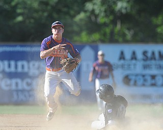 Creekside infielder #2 Steve Sada flies through the air after theorizing the ball, after stepping on second base to force out Grays base runner #42 Osvaldo Ovalle. This would end the inning. 