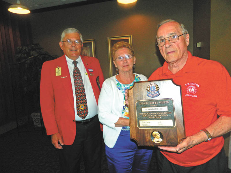 SPECIAL TO THE VINDICATOR: Austintown Lions and Lioness clubs installed officers recently at Rachel’s Restaurant in Austintown. King Lion Larry Jensen presided, and the Lions Club marked its 36-year anniversary. Bob Booher, from Canal Fulton Lions Club, served as the installing officer. The highlight of the event was the presentation of the Melvin Jones Fellowship Award to Don Hoelzel for dedicated humanitarian service. From left are Booher, past district governor; June Hoelzel; and Don Hoelzel.