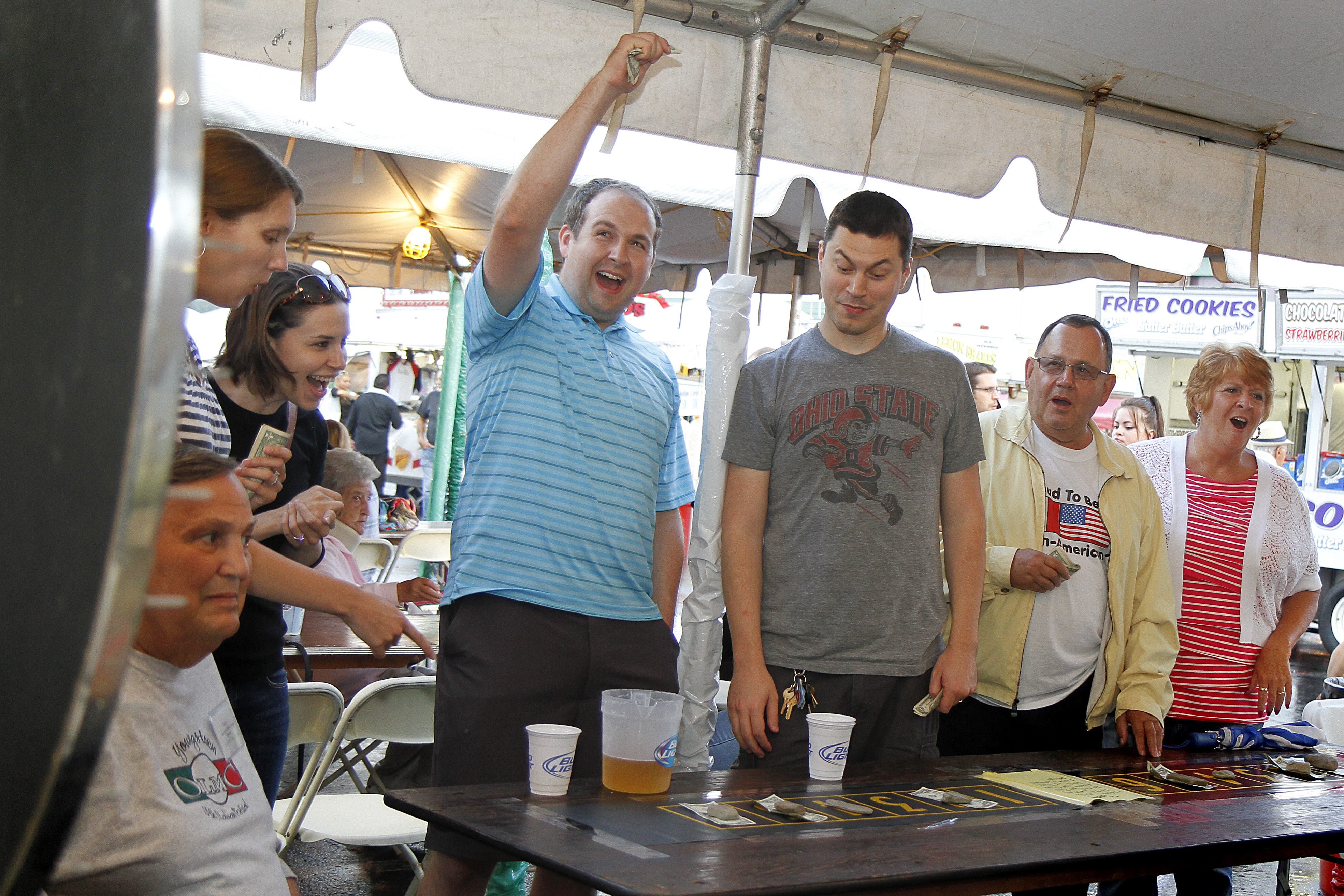 MADELYN P. HASTINGS | THE VINDICATOR

(L-R) Tony Frank of Youngstown, Daron Ducay of Columbus, Abby Mosier of Youngstown, Brian Mosier of Columbus, Matt Ducay of Youngstown, Mark and Nancy Preteroti of Lisbon react to a chuck-a-luck game at the 15th annual Our Lady of Mount Carmel Italian Festival on Saturday, July 27.