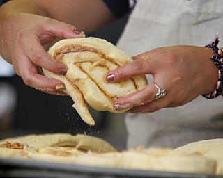 MADELYN P. HASTINGS | THE VINDICATOR

Krista Ulbricht of Youngstown makes cinnamon rolls for the Rimedio's Bakery stand at the 15th annual Our Lady of Mount Carmel Italian Festival on Saturday, July 27.