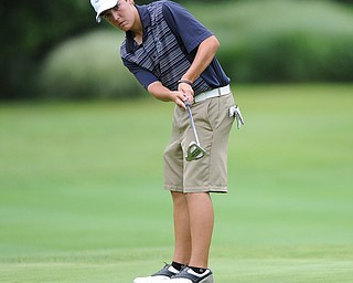 Billy Colbert of Hermitage follows through on his putt on a hole on the back 9 Sunday afternoon at Trumbull Country Club.