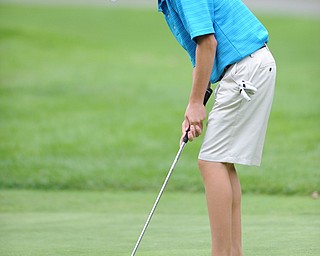 Daniel Lapolla of Warren follows through on his putt on a hole on the back 9 Sunday afternoon at Trumbull Country Club.