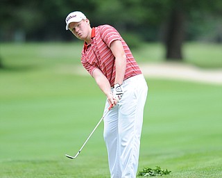 Nolan Snyder of Western Reserve chips his ball from the short rough and onto the green on a hole on the back 9 Sunday afternoon at Trumbull Country Club.