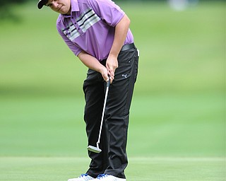 Donavan Ray of Howland follows through on his putt on a hole on the back 9 Sunday afternoon at Trumbull Country Club.