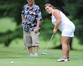 Alexis Cadle follows through on her putt on a hole on the back 9 Sunday afternoon at Trumbull Country Club.