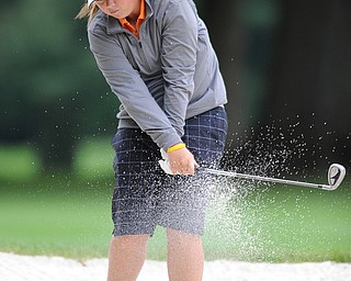 Kaylee Neumeister works on chipping her ball out of a sand trap on a hole on the back 9 Sunday afternoon at Trumbull Country Club.