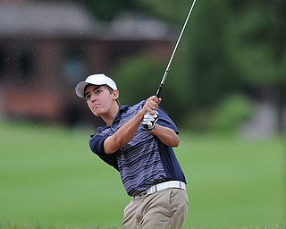 Billy Colbert of Hermitage chips his ball out of trouble and toward the green on a play off hole Sunday afternoon at Trumbull Country Club.