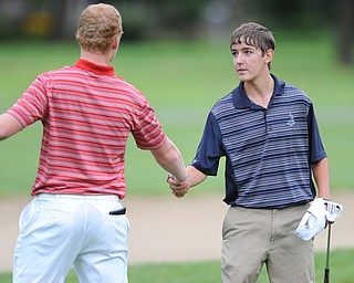 Billy Colbert of Hermitage shakes hands with Nolan Snyder after winning on a playoff hole Sunday afternoon at Trumbull Country Club.