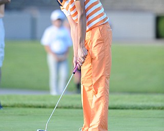 Ken Keller follows though on his putt on the 18th hole Sunday afternoon at Trumbull Country Club.