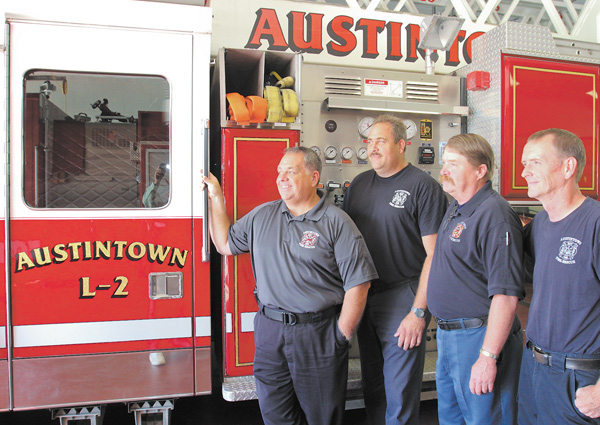 The Austintown Fire Department was established in 1938. Current members include, from left, Andrew Frost III, fire chief; firefighter Tom Neff ; Bob Williams, assistant fire chief; and Capt. Dan Martin.