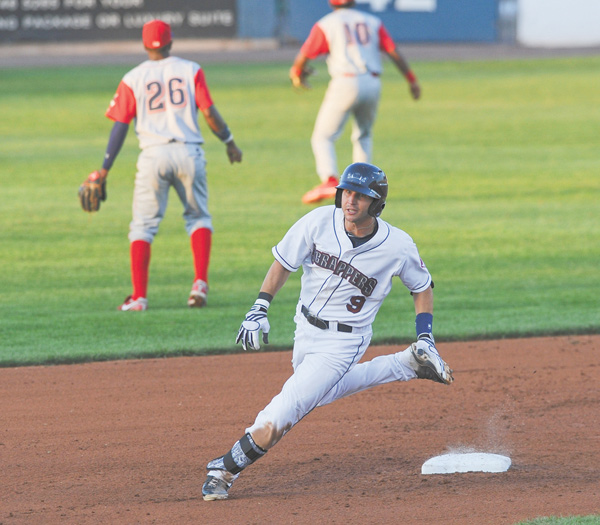 Scrappers baserunner Paul Hendrix sprints to third base to leg out a triple during the bottom of the fourth inning of Monday’s game at Eastwood Field.