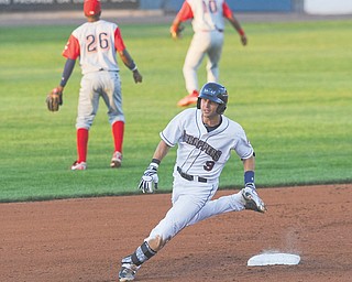 Scrappers baserunner Paul Hendrix sprints to third base to leg out a triple during the bottom of the fourth inning of Monday’s game at Eastwood Field.