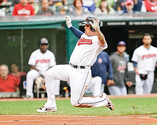 Cleveland’s Asdrubal Cabrera runs home to score on a sacrifice fly by Carlos Santana in the second inning of Monday’s game against the Chicago White Sox at Progressive Field.
