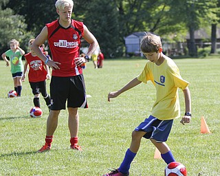        ROBERT K. YOSAY  | THE VINDICATOR

Simon Slater watches as Alec DeBaldo 12 of Austintown   move the ball down the field

British soccer camp   Wick Recreation Area of MillCreek Park week-long soccer camp focuses on building skills to play the game along with sportsmanship