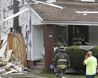        ROBERT K. YOSAY  | THE VINDICATOR

firefighters check out the house next door to the explosion

The house at 535 Cohasset Drive was vacant but the house next door at 539 Cohasset is damaged. In addition, at least four homes across the street from the blast had windows that were broken by the force of the explosion. 
