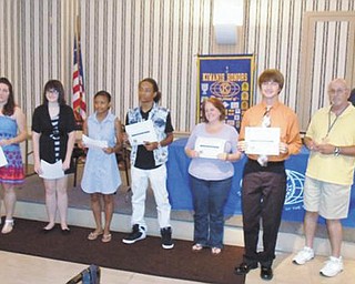 SPECIAL TO THE VINDICATOR
Kiwanis Club of Youngstown awarded scholarships July 12 to six college-bound students from the area. Each received $500. Five will attend Youngstown State University, and all earned grade-point averages of 3.5 or higher. Financial need also was a consideration. Winners, from left, were Marina Bermann of Ursuline High School, Megan Christ of Chaney STEM/VPA, LaTieya Richard of Cardinal Mooney, LaJuan Thomas of East, Allie Klumpp of Youngstown Christian (accepted by her mother), and Travis Filicky of Boardman. Tom Eisenbraun, Kiwanis member and chairman of the scholarship committee is at the far right, and in the background is Gary Winslow, Kiwanis president.

