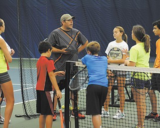 Brian Fry, director of tennis at Avalon Golf & Country Club, speaks with tennis players including Garret Kuchmaner, Colin Gramley, Kaytlin Marlatt, Devin Gramley, Jason Khavari, Isabella Elisco, Michael Awadalla.