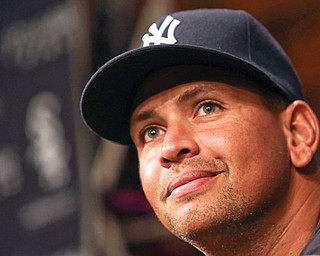 The Yankees’ Alex Rodriguez listens during a news conference before Monday’s game against the Chicago White Sox in Chicago. Rodriguez and 12 other players were suspended by MLB effective immediately for their parts in the Biogenesis drug scandal.