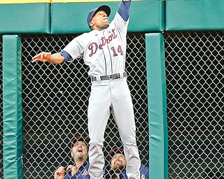 Tigers center fielder Austin Jackson makes a leaping catch in front of the Indians bullpen to rob Cleveland’s Lonnie Chisenhall of a home run in the second inning of Monday’s baseball game in Cleveland. The Indians were three outs away from downing the AL Central leaders when Alex Avila hit a three-run shot off Indians closer Chris
Perez to boost Detroit to a 4-2 win.