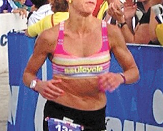 Jessica Marino, a 2000 graduate of Poland High School, nears the finish line at the Ironman event in Lake Placid, N.Y., on July 28. Marino, who lives in New York, placed fourth at the event and qualified for the 35th Ironman
World Championship, which is set for Oct. 12 in Kailua-Kona, Hawaii.