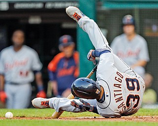 The Tigers’ Ramon Santiago falls to the ground after being hit by a pitch by Indians starting pitcher Justin Masterson in the fifth inning of Tuesday’s baseball game in Cleveland. Cleveland fell 5-1.