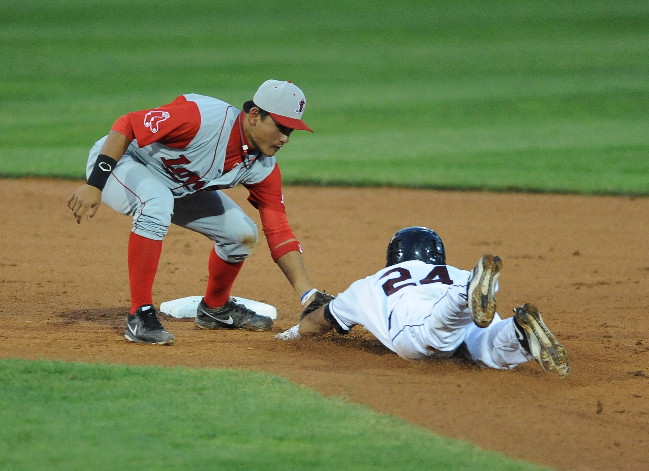 Lowell infielder #7 Tzu-Wei Lin tags out scrappers base runner #24 Brian Ruiz who was attempting to stretch a single into a double in the bottom of the 6th inning. This would end this inning. 