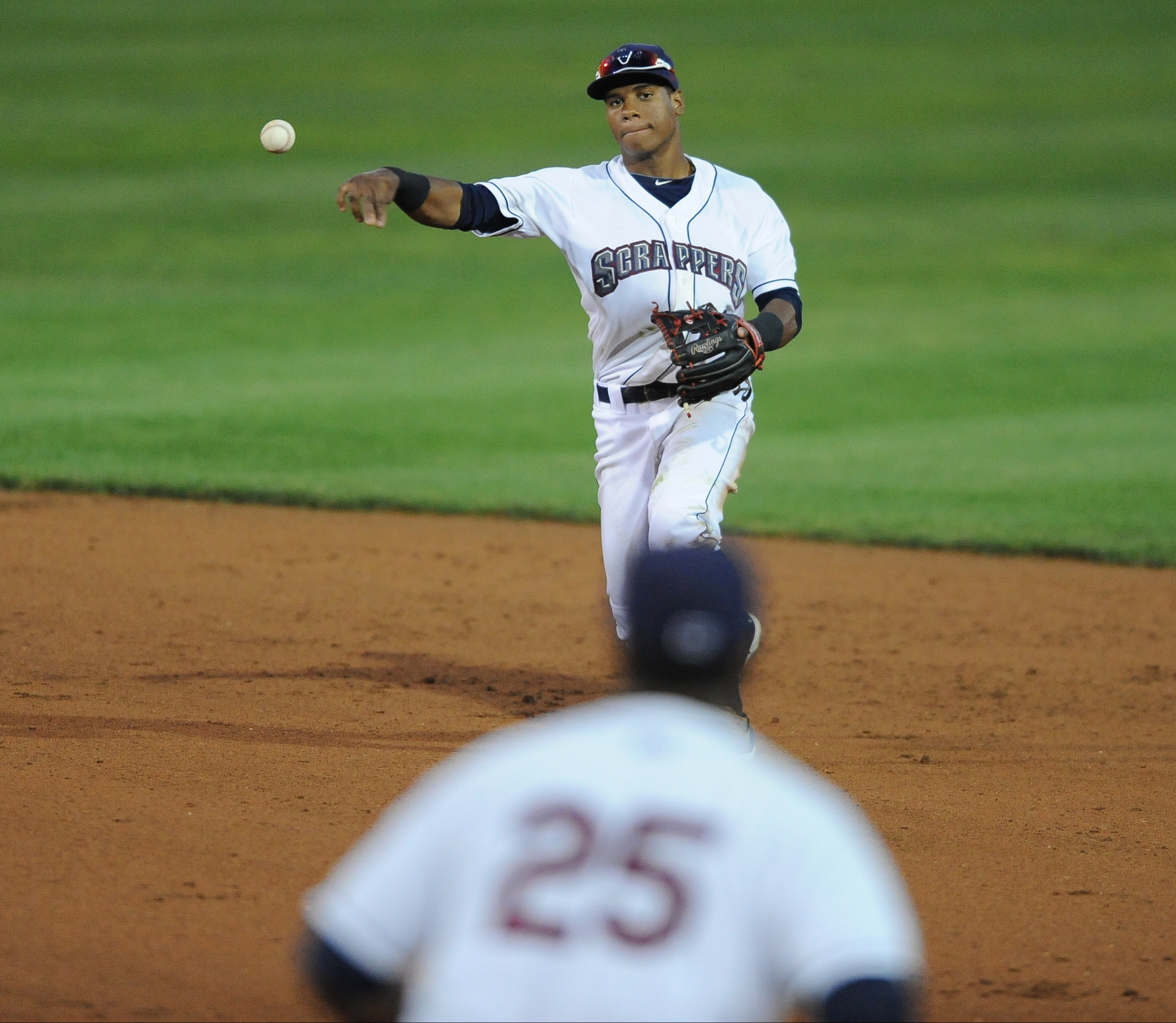 Scrappers second basemen #12 Claudio Bautista throws the ball to first basemen #25 Nellie Rodriguez for the out. 
